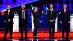 U.S. presidential candidate and former U.S. Secretary of State Hillary Clinton waves as she stands with fellow candidates (L-R) former U.S. Senator Jim Webb, U.S. Senator Bernie Sanders, former Maryland Governor Martin O'Malley and former Governor of Rhode Island Lincoln Chafee at the first official Democratic candidates debate of the 2016 presidential campaign in Las Vegas, Nevada October 13, 2015. REUTERS/Lucy Nicholson